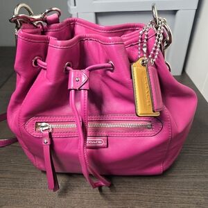 Coach Pink Shoulder Bag with Drawstring Closure and Silver Accents
